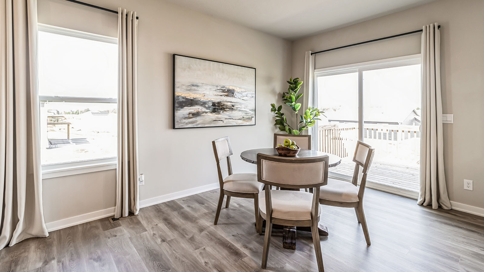 Open concept dining space with access to backyard