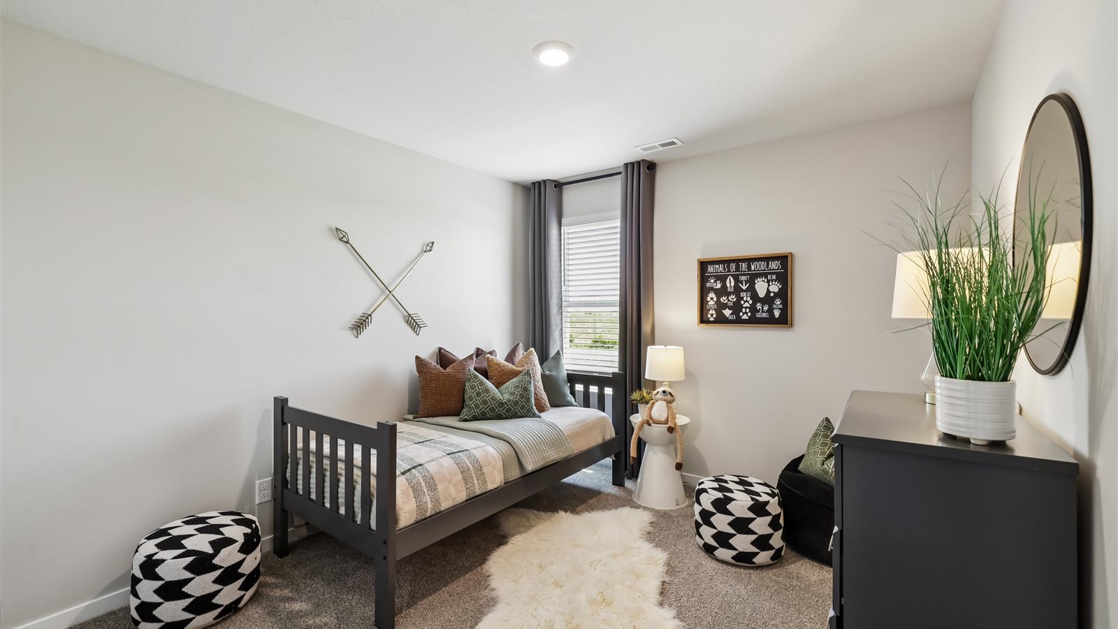 Comfortable secondary bedroom with natural light, modern finishes, and versatile living space.