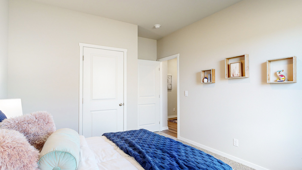 Comfortable secondary bedroom with natural light, modern finishes, and versatile living space.