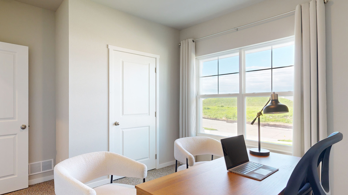 Comfortable secondary bedroom with natural light, modern finishes, and versatile living space.