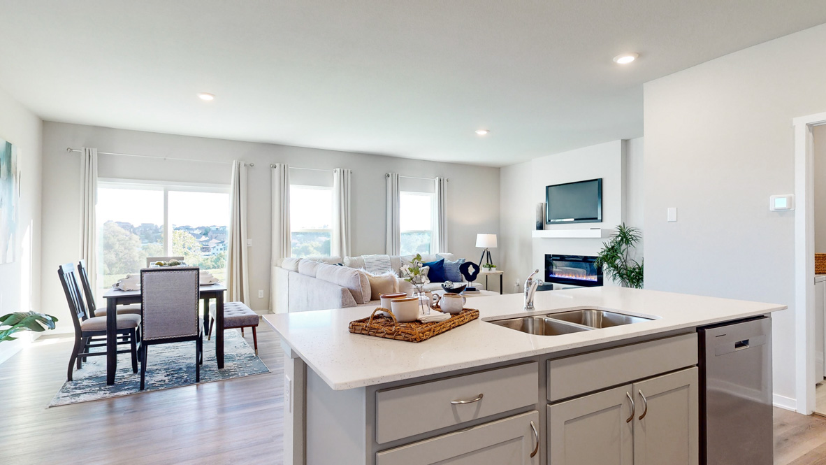 Kitchen with white cabinetry and quartz countertop