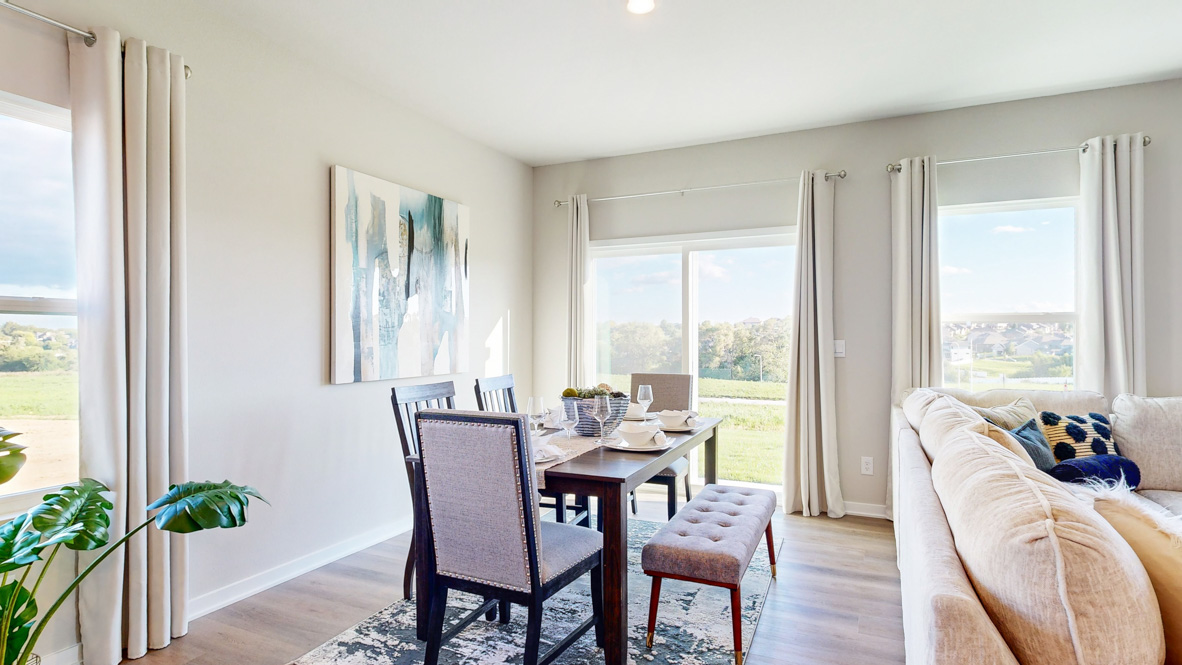 Open concept dining space with access to backyard