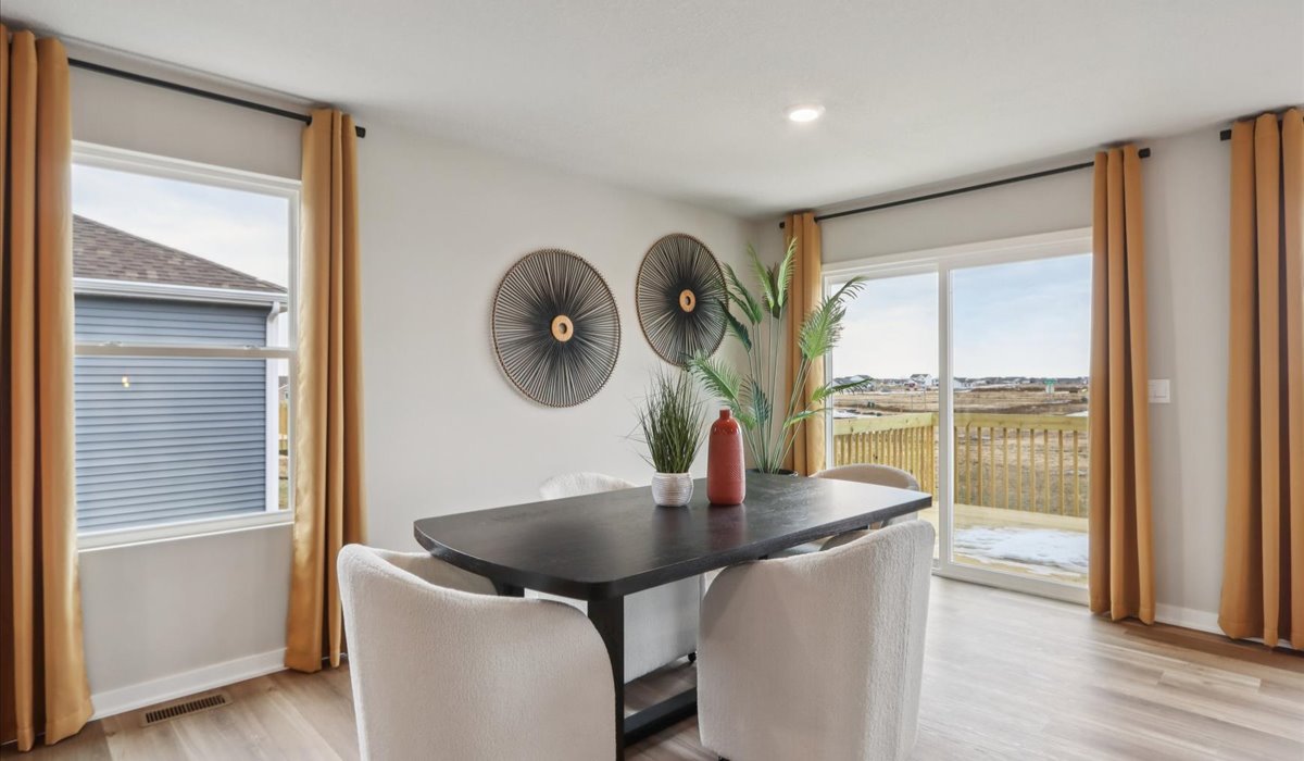 Open concept dining space with access to backyard