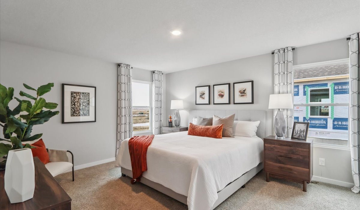 Primary bedroom with natural lighting and spacious layout