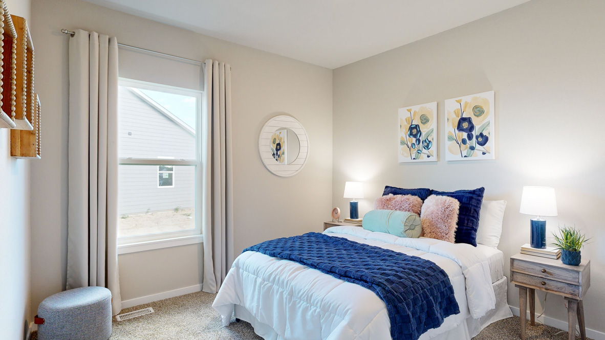 Comfortable secondary bedroom with natural light, modern finishes, and versatile living space.