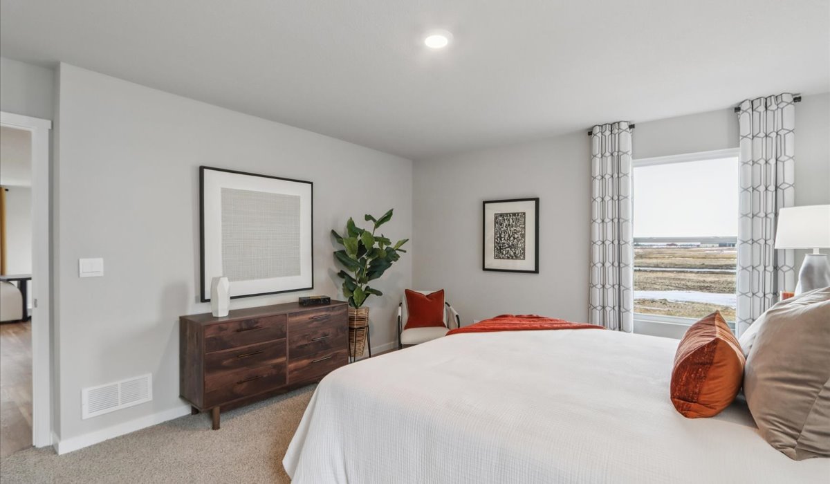 Primary bedroom with natural lighting and spacious layout