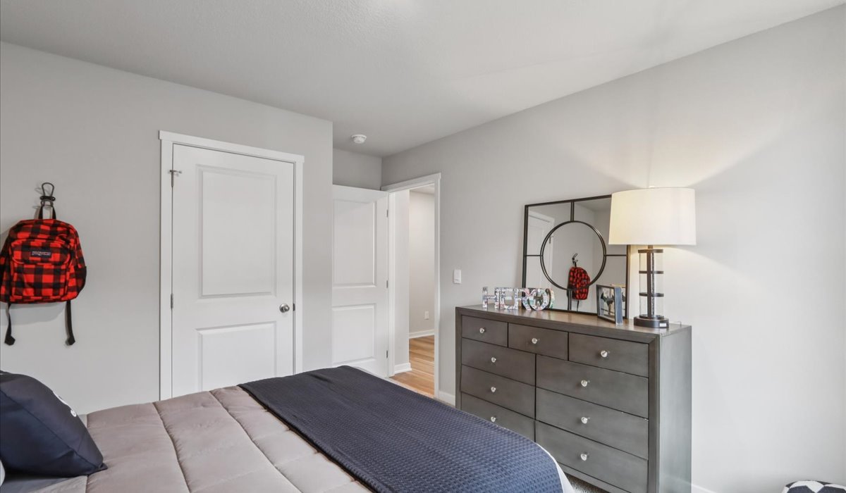 Comfortable secondary bedroom with natural light, modern finishes, and versatile living space.