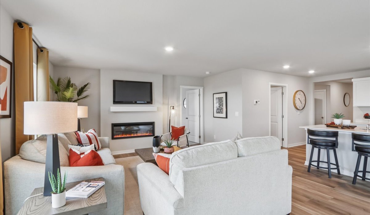 Open concept living room with electric fireplace
