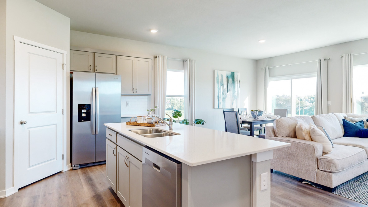 Kitchen with white cabinetry and quartz countertop