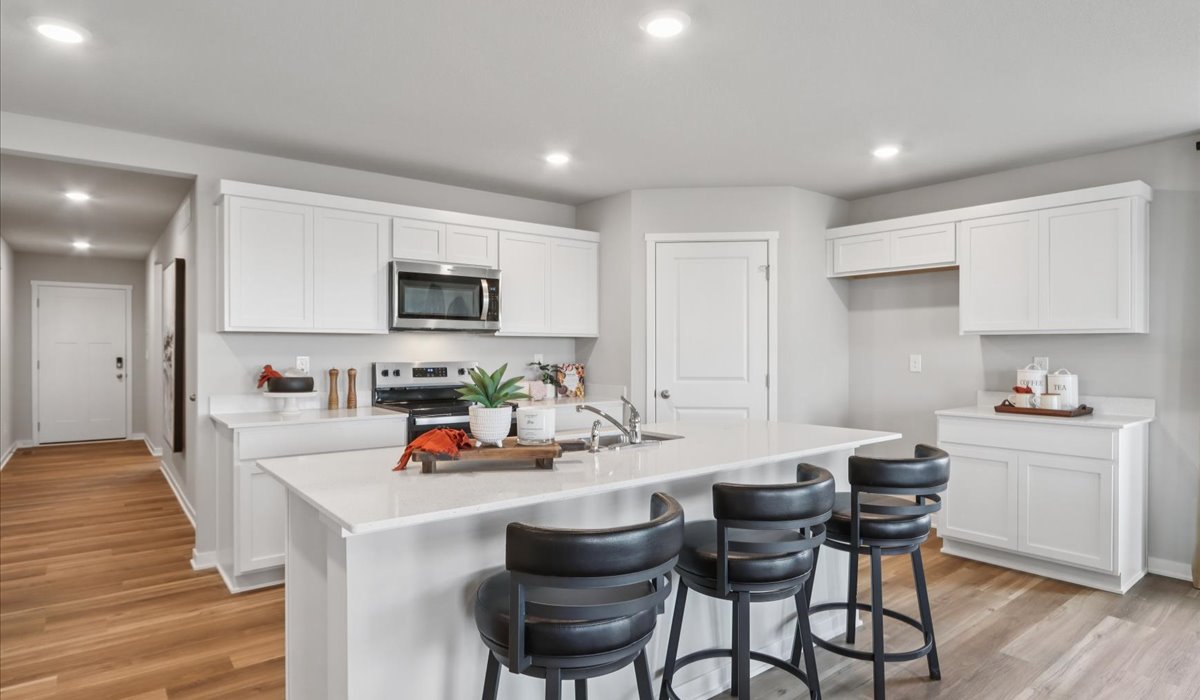 Kitchen with white cabinetry and quartz countertop
