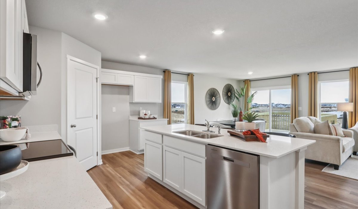 Kitchen with white cabinetry and quartz countertop