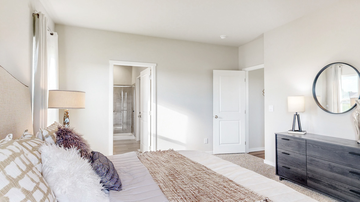 Primary bedroom with natural lighting and spacious layout
