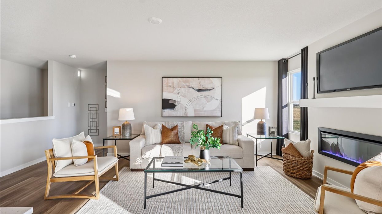 cozy living room with mounted tv and electric fireplace