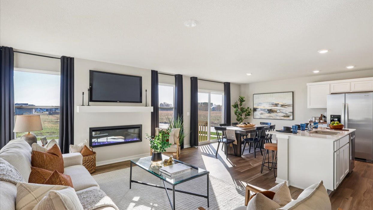 open concept living room with lots of window for natural lighting