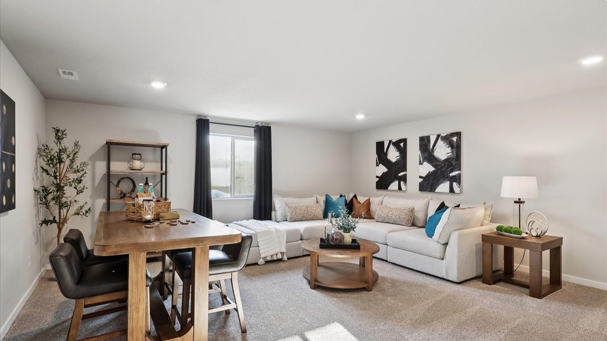 Finished basement living area with comfortable seating space and flexible room for entertaining or relaxing.