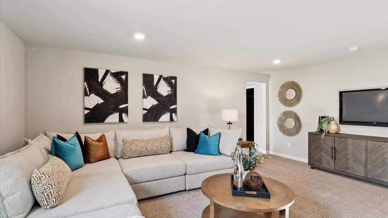 Finished basement living area with comfortable seating space and flexible room for entertaining or relaxing.