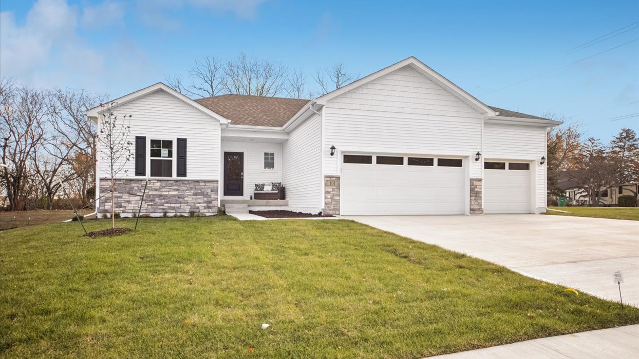 front exterior of reagan home with 3 car attached garage