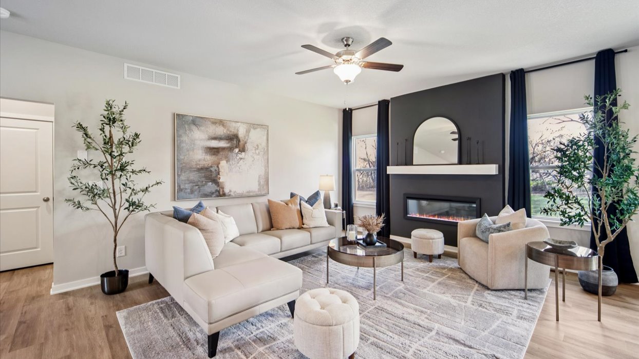 modern reagan living room with accent wall and electric fireplace