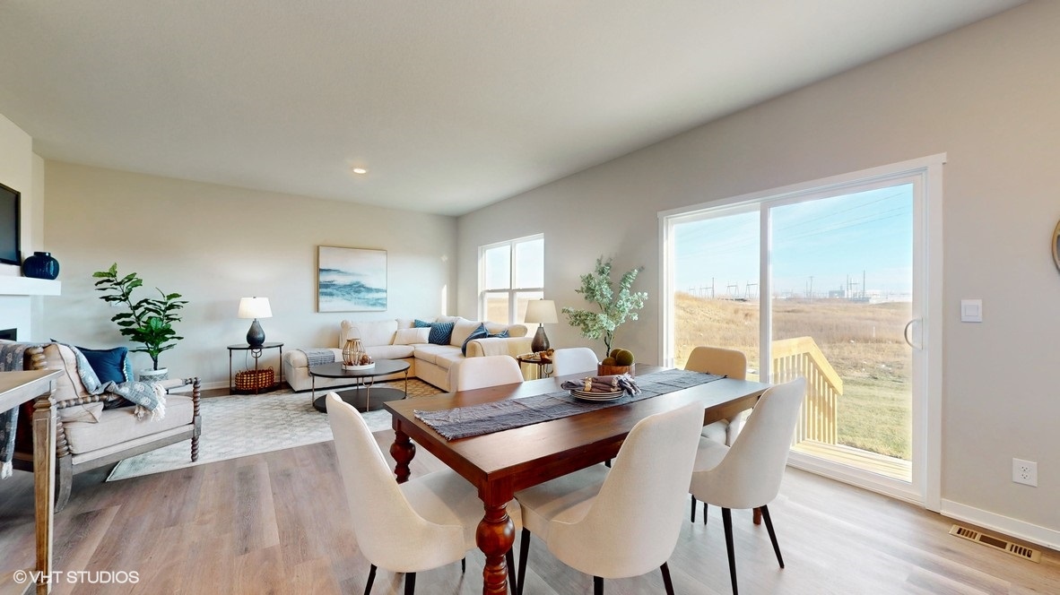 brown dining room table with white chairs