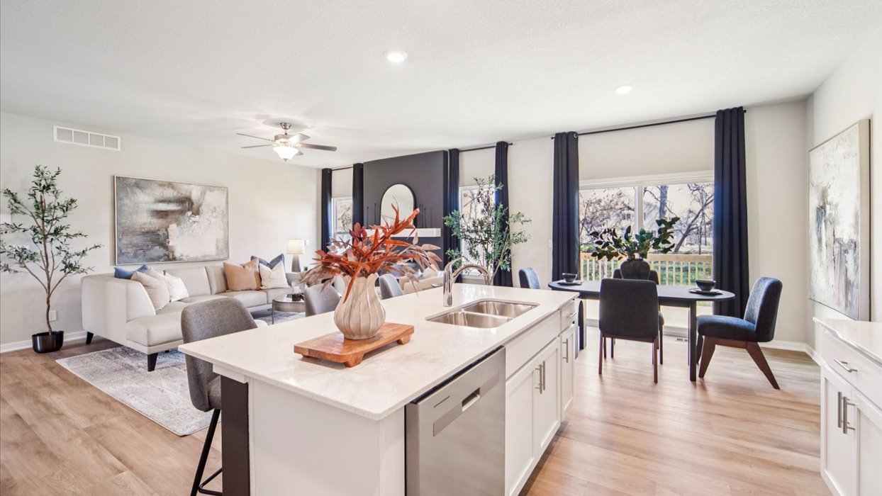 open concept main floor showing kitchen island and dining area