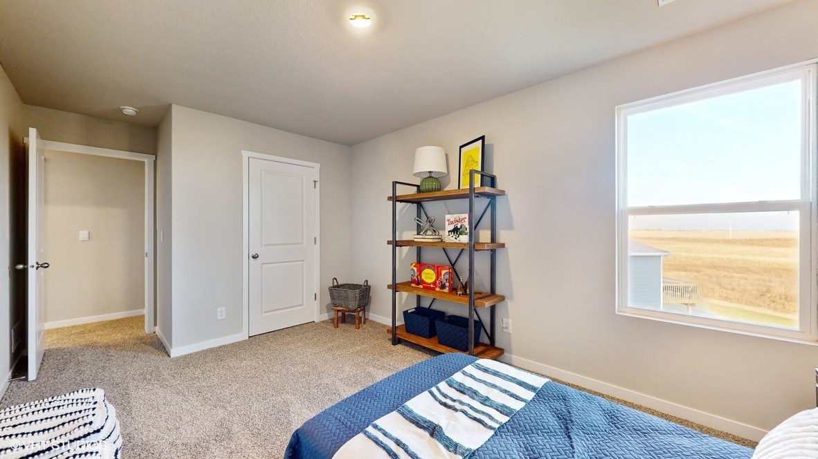 third bedroom with blue twin bed