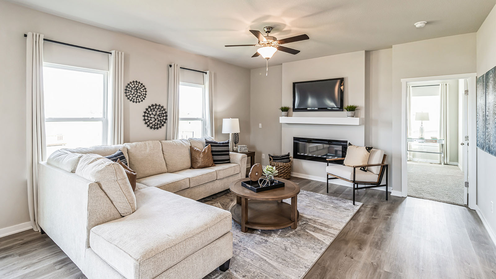 Open concept living room with electric fireplace