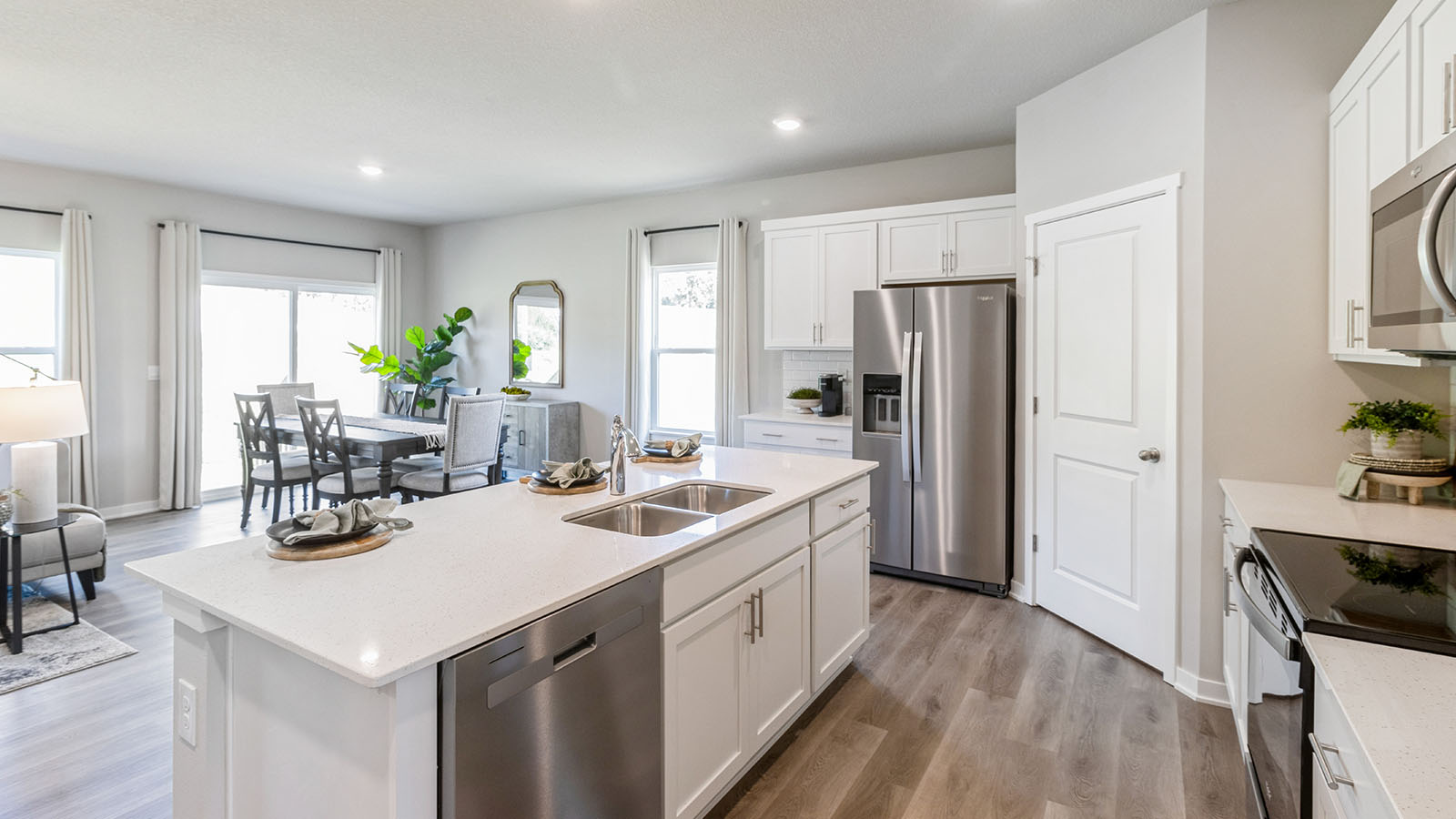 white kitchen with stainless-steel appliances