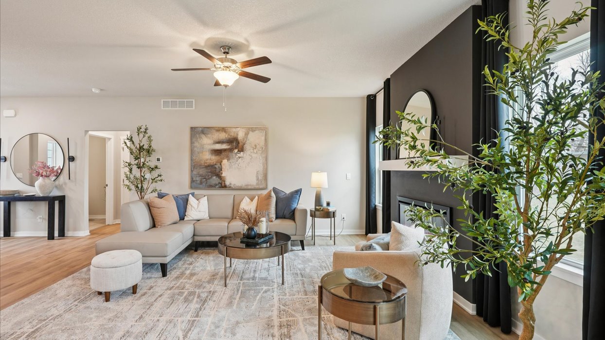 reagan living room with electric fireplace and ceiling fan