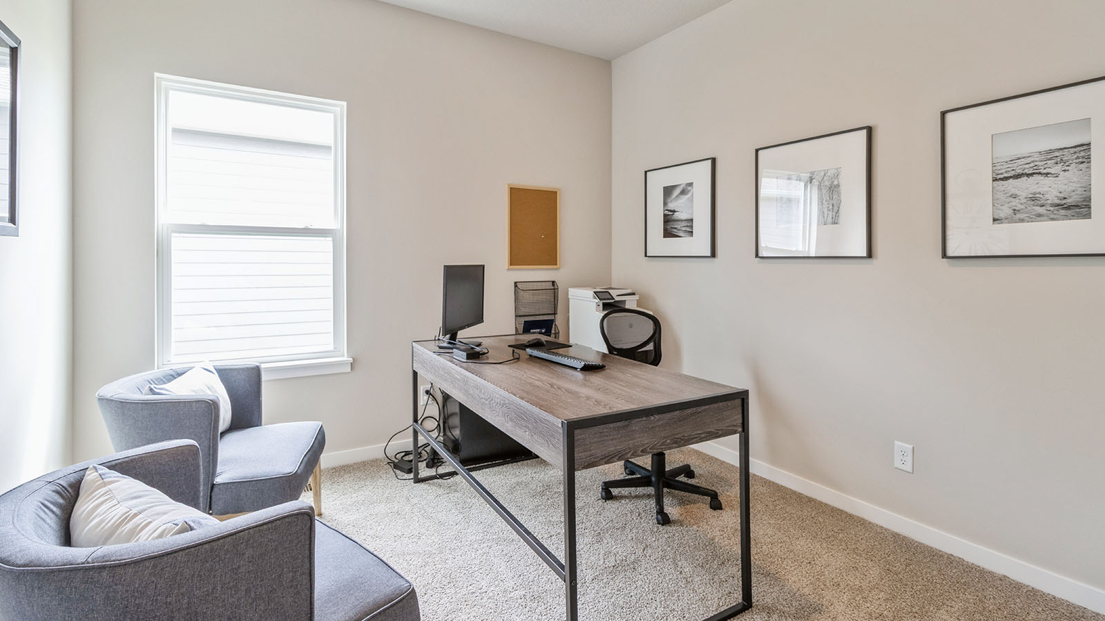 second bedroom staged as a desk with small window