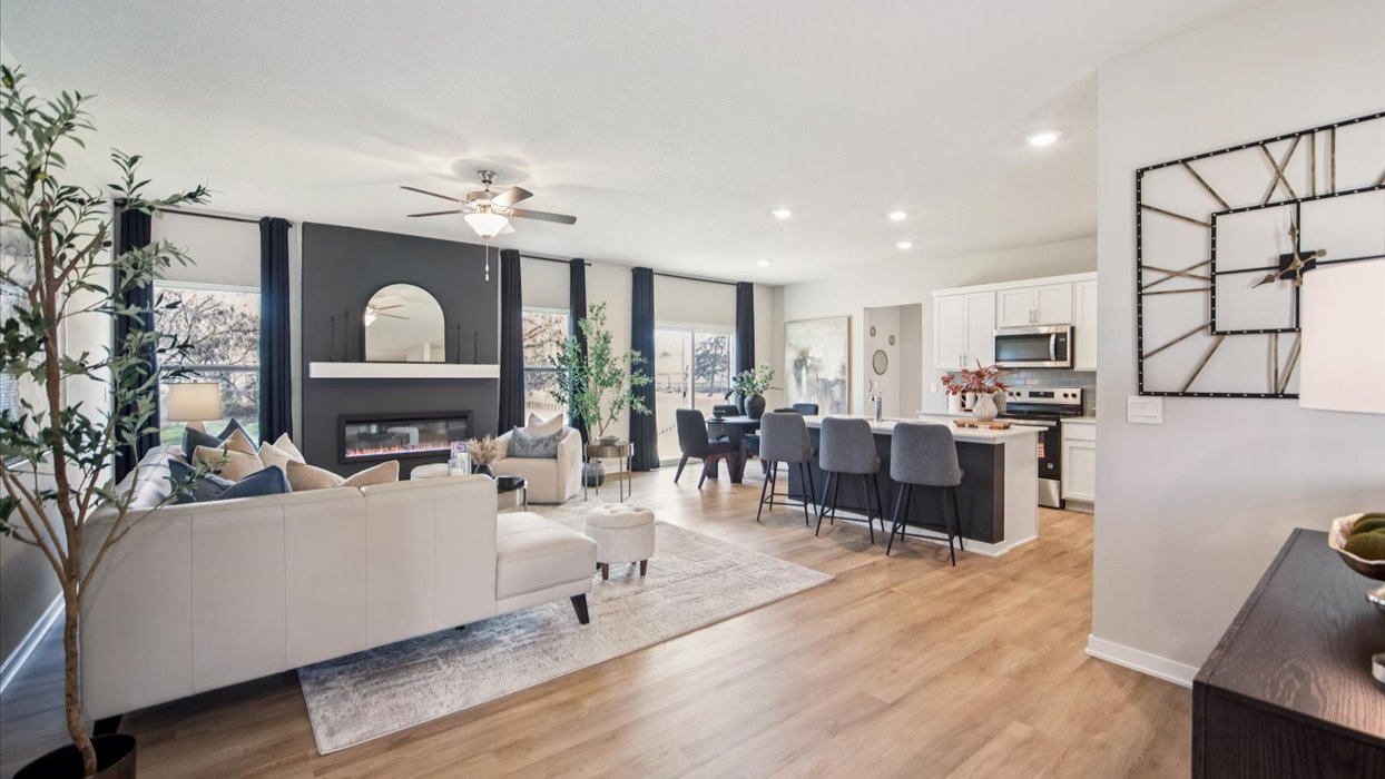 Living room designed for flexibility with seating space and connection to kitchen and dining areas. Edgewood Trail