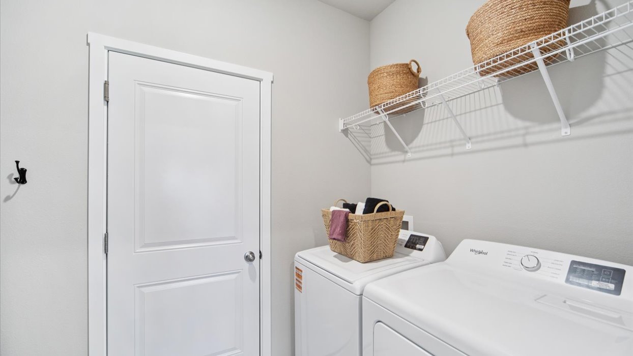 Family full bathroom 2with vanity, mirror, cabinetry, and tub-shower combination.