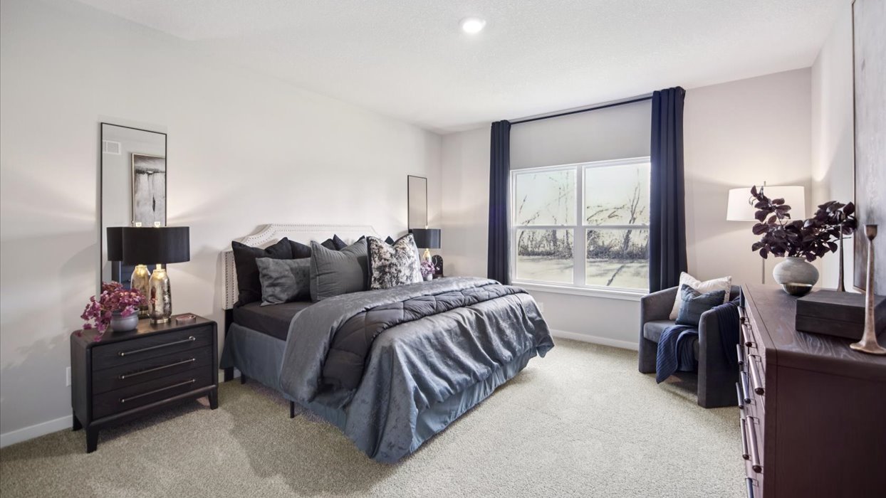 Alternate primary bedroom view showcasing layout and restful design. Edgewood Trail