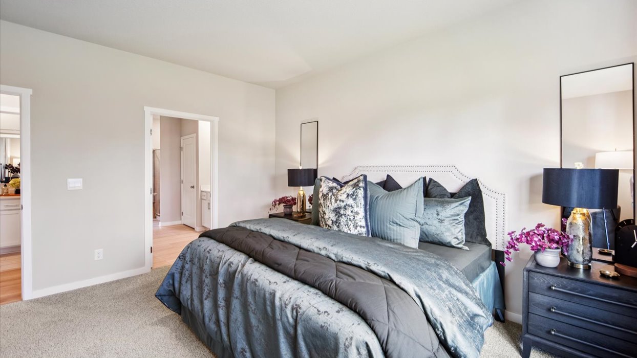 Primary bedroom designed with privacy and comfort in mind, flowing into the spa-inspired ensuite and walk-in closet.