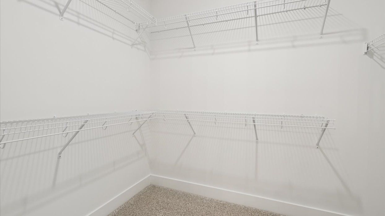 Spacious walk-in closet offering ample room for clothing, accessories, and everyday essentials.