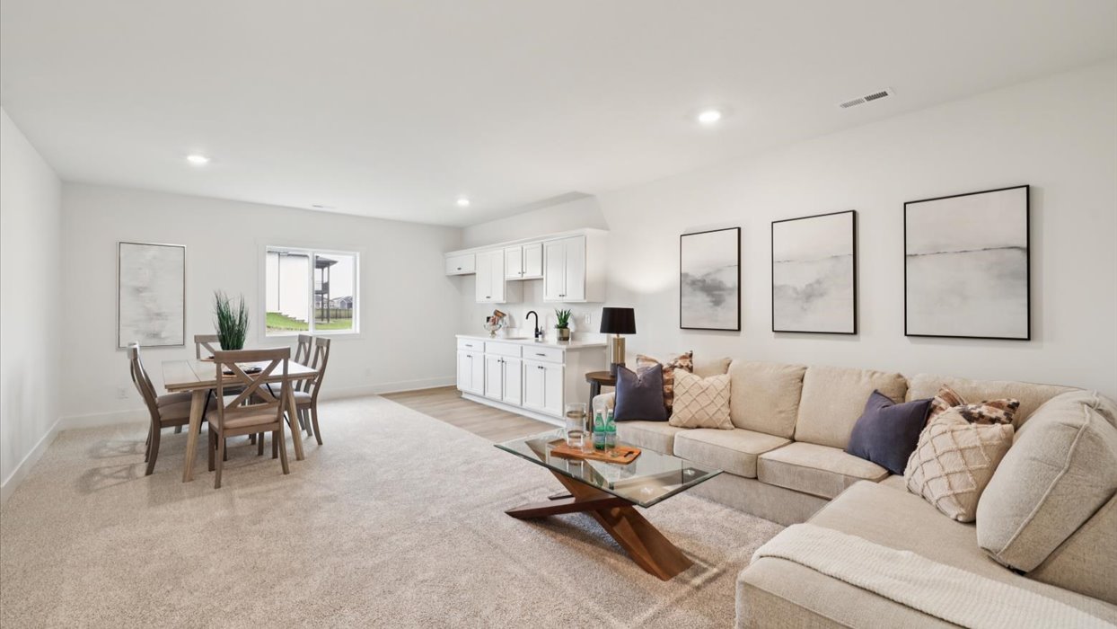 Finished basement living area with comfortable seating space and flexible room for entertaining or relaxing.