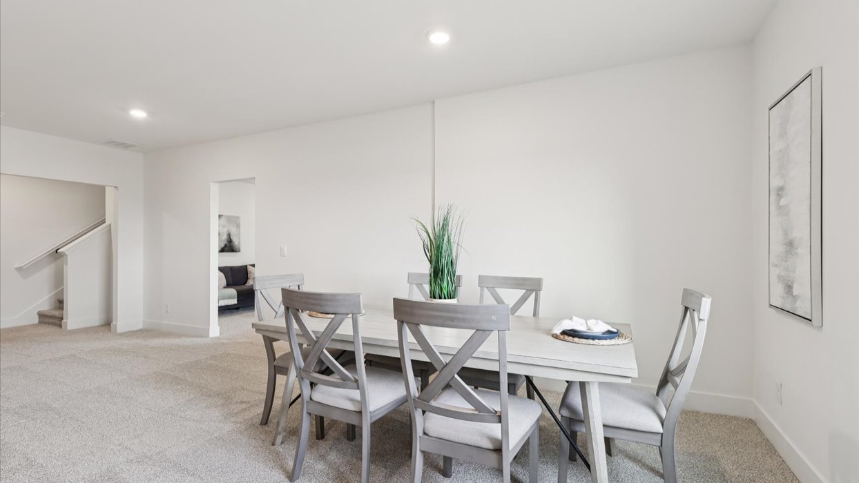 Finished basement living area with comfortable seating space and flexible room for entertaining or relaxing.