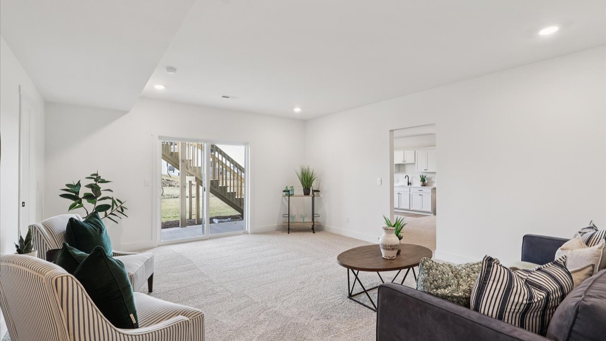 Finished basement living area with comfortable seating space and flexible room for entertaining or relaxing.