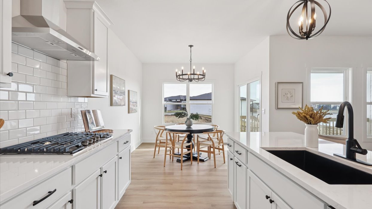 Kitchen with white cabinetry and quartz countertop