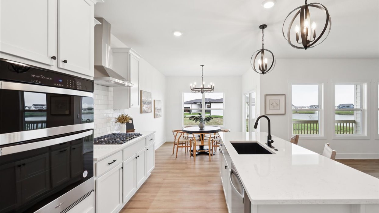 Kitchen with white cabinetry and quartz countertop