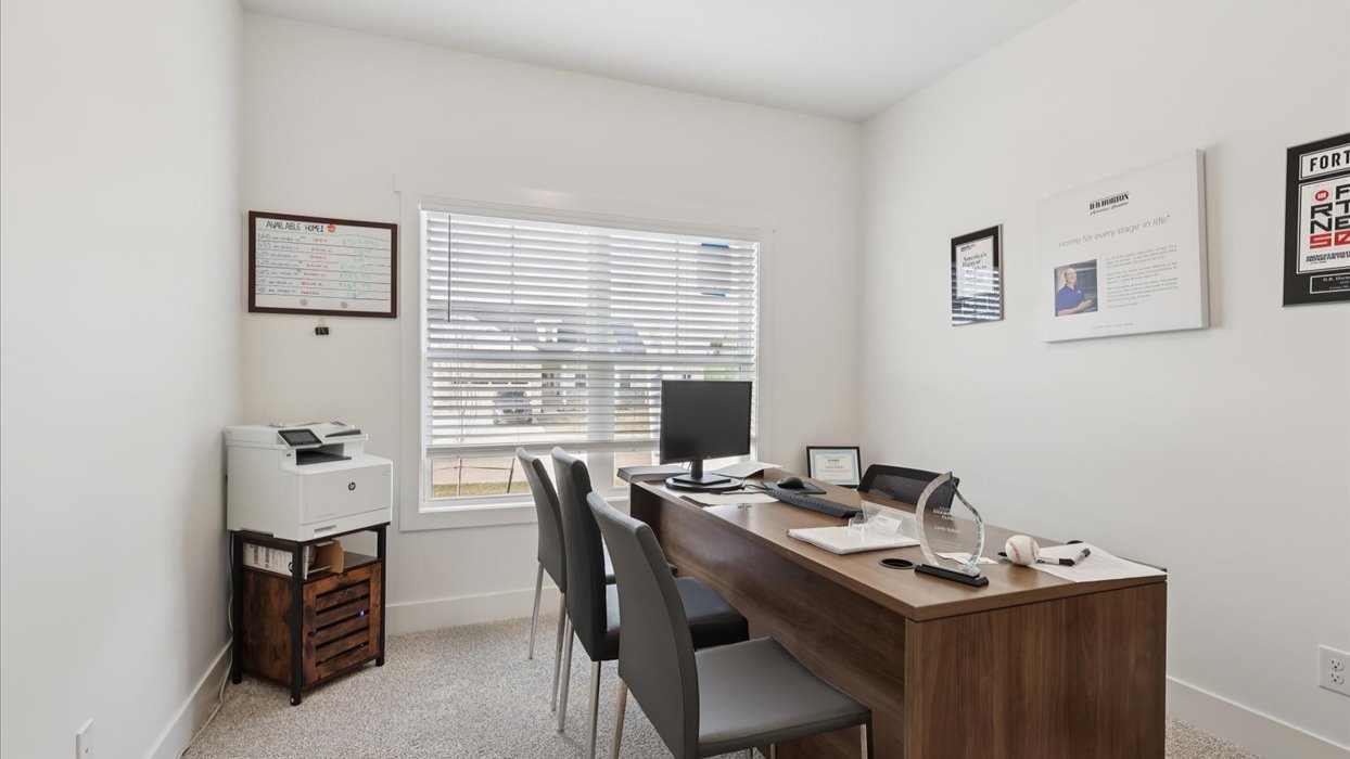 first bedroom staged as an office