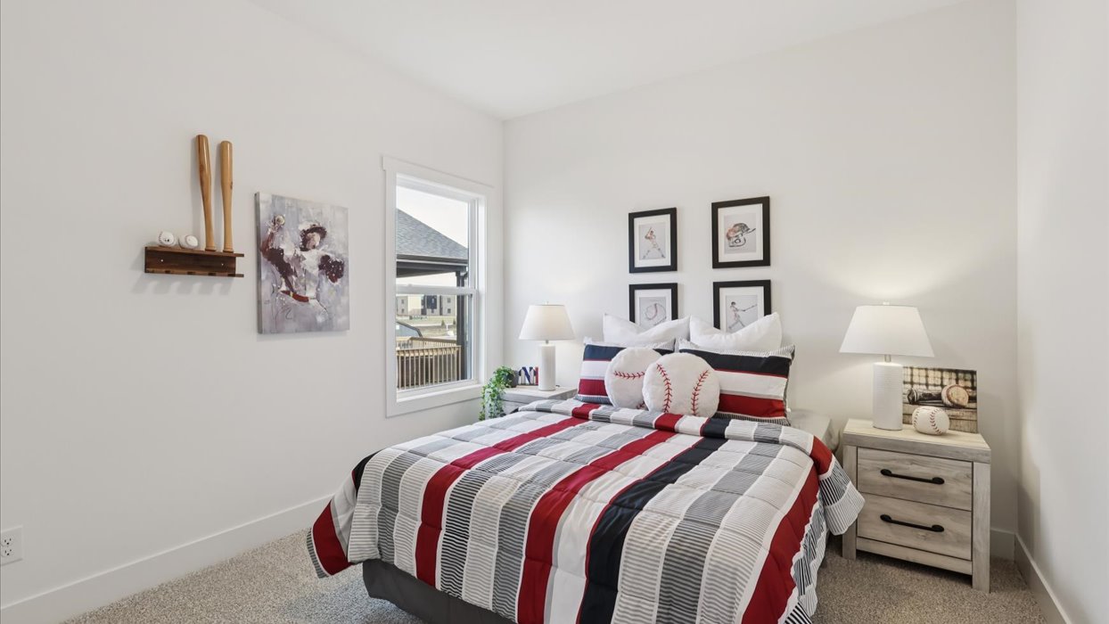 second bedroom with queen bed and white nightstands