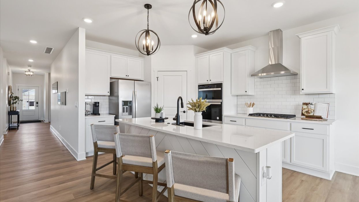 kitchen with white cabinets and island