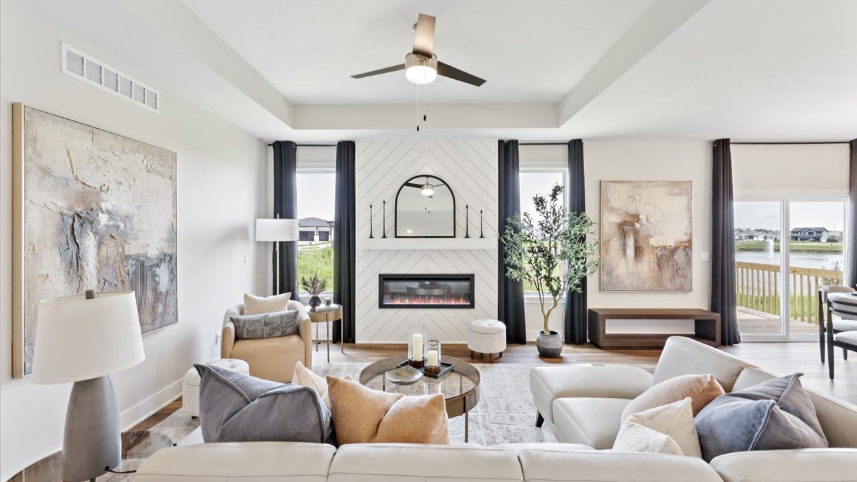 bright and spacious madison living room with ceiling fan and lots of windows