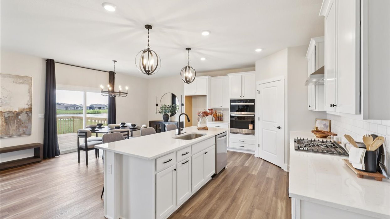 kitchen with white cabinets and quartz coiuntertops