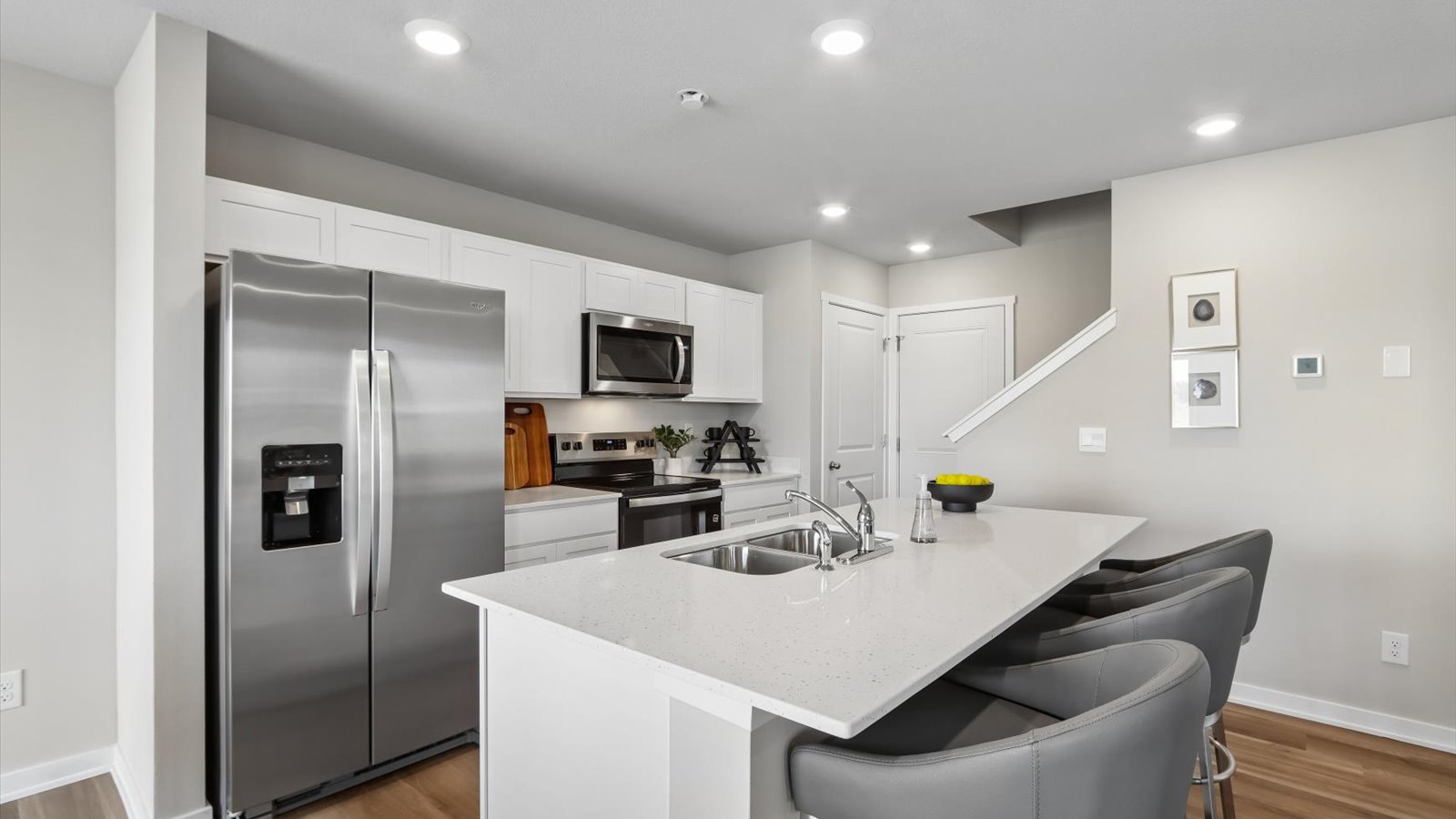 Kitchen with white cabinetry and quartz countertop