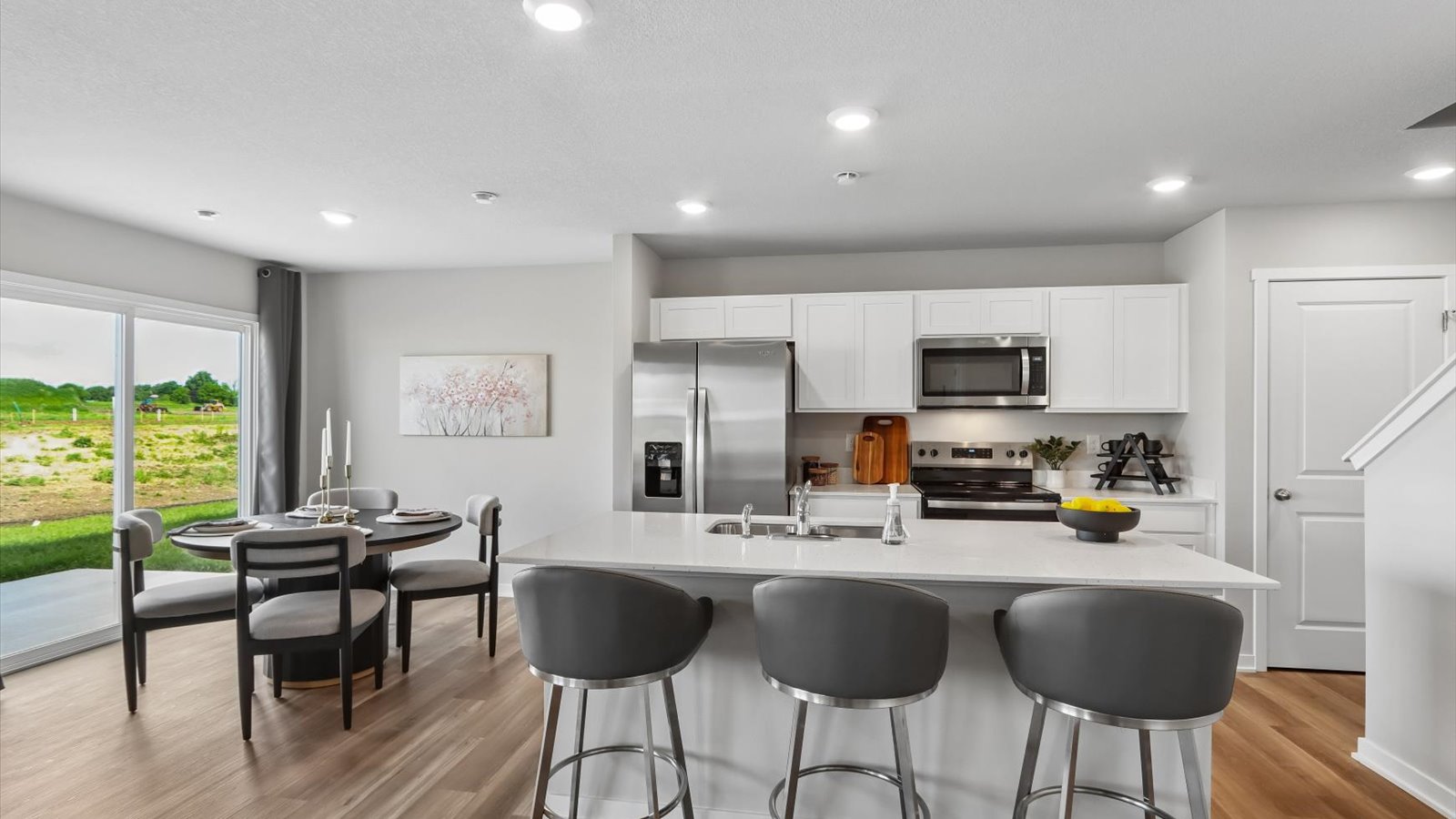 Kitchen with white cabinetry and quartz countertop