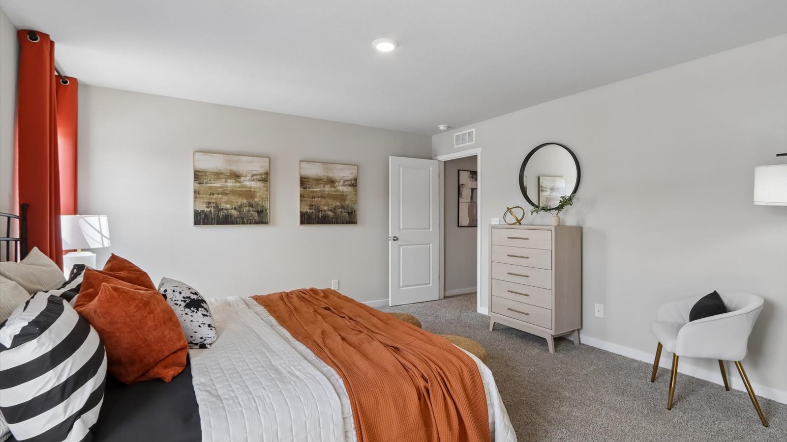 Primary bedroom with natural lighting and spacious layout