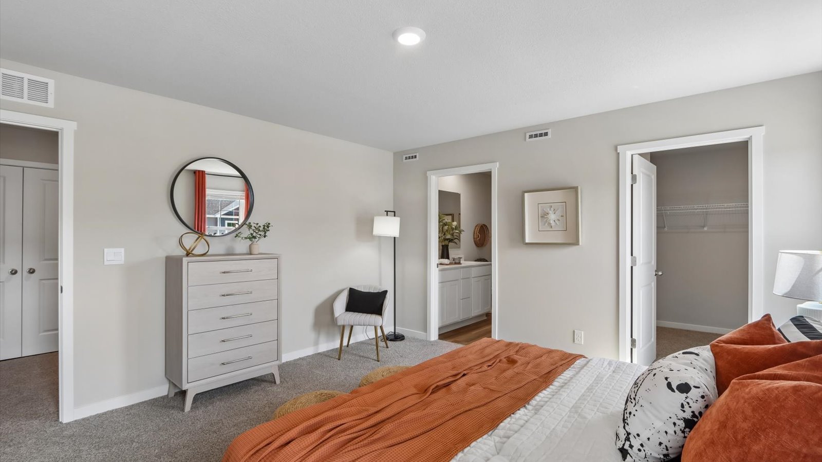 Primary bedroom with natural lighting and spacious layout