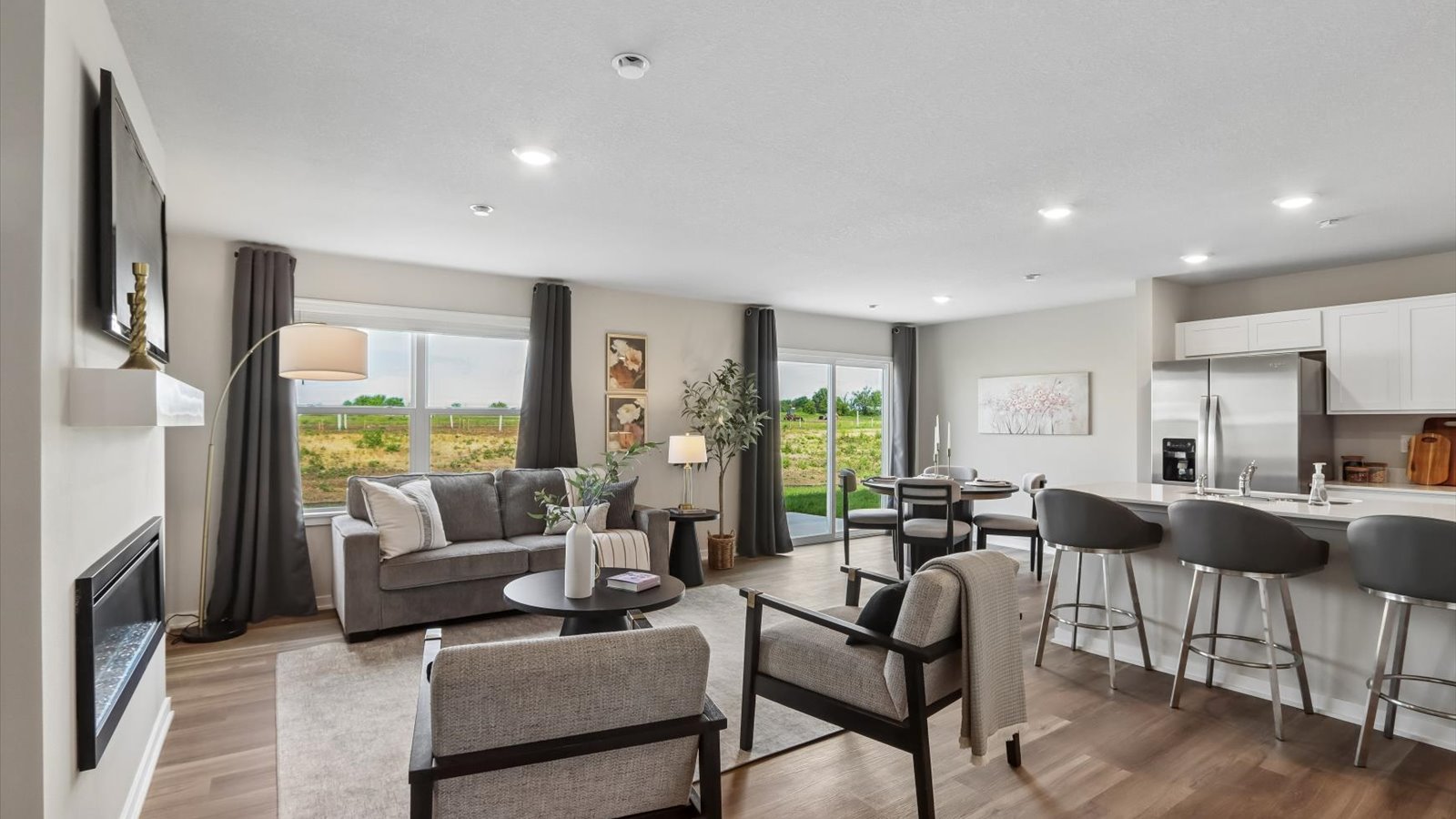 Open concept living room with electric fireplace