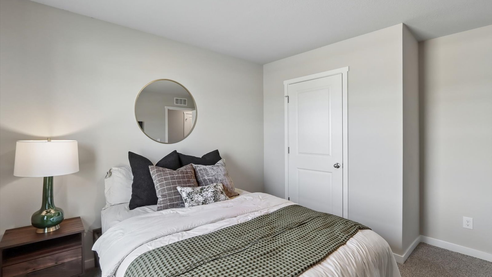 Comfortable secondary bedroom with natural light, modern finishes, and versatile living space.